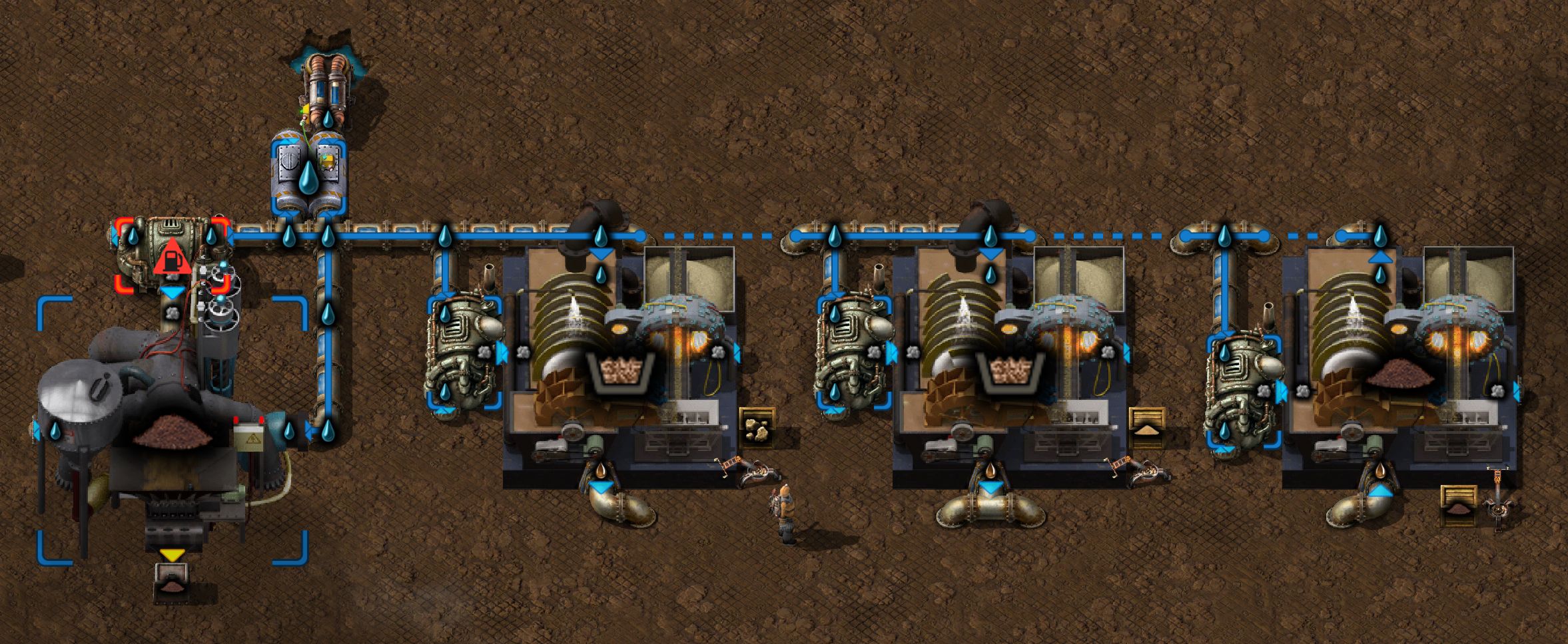 A modified version of the soil to stone and sand to muddy water recycling chain, with the water output of the muddy water separation plant fed back into the water input line. The line now has a storage tank on it, which is wired to a pump.